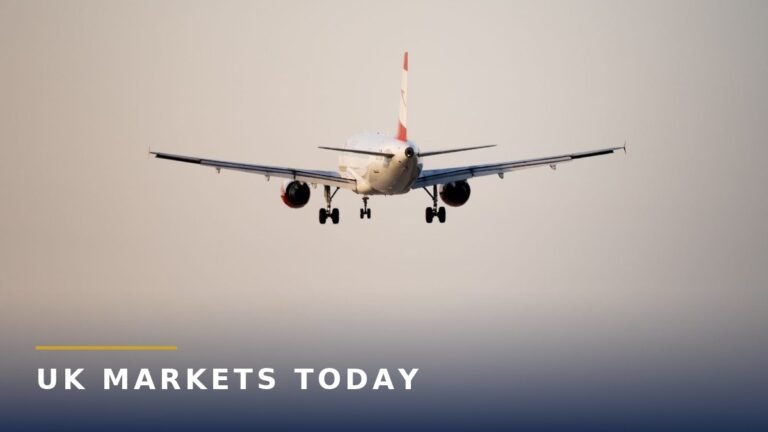A passenger jet coming in to land at an airport with terminal buildings in the background, for the Birmingham Airport masterplan story