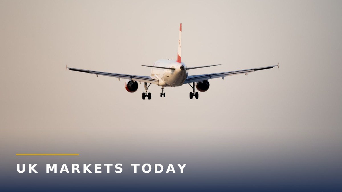 A passenger jet coming in to land at an airport with terminal buildings in the background, for the Birmingham Airport masterplan story