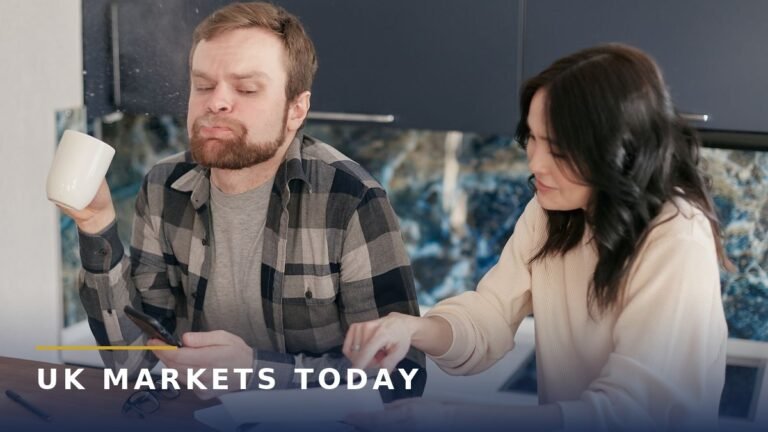 A couple reviewing energy bills at a kitchen table