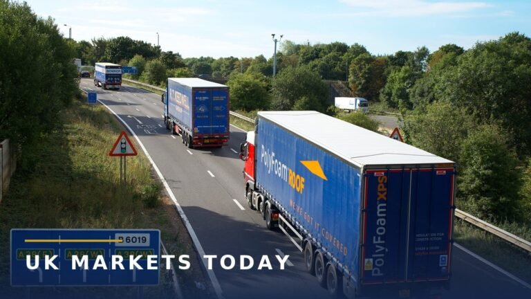 Articulated lorries driving on the A38 dual carriageway in England, illustrating the NHS lorry drivers strike by GXO drivers who deliver medical supplies to hospitals