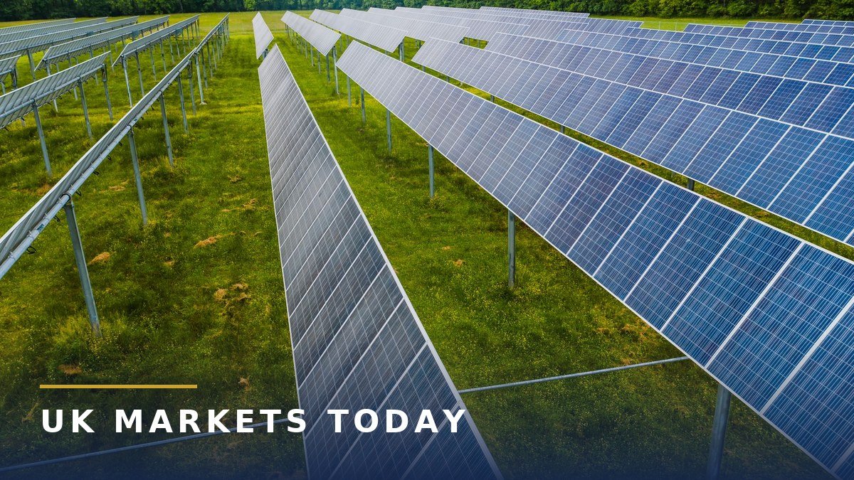 Rows of blue solar panels on a green field at a solar farm, for the Steeple Renewables Project story